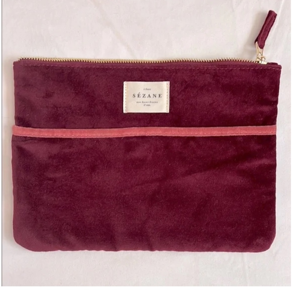 Sézane burgundy cotton velvet zip pouch featuring a gold zipper